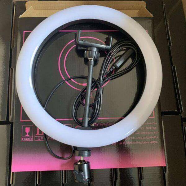 10-inch LED ring light with adjustable phone holder, ideal for video and live streaming setups.